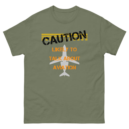 The "Caution Likely To Talk About Aviation" t-shirt features a bold logo on the front featuring airport and aviation graphics.