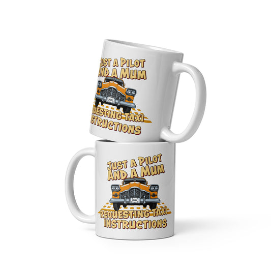 Ceramic white glossy mug with a cartoon of a New York City Taxi and the slogan "Just a Pilot and a Mum Requesting Taxi Instructions"