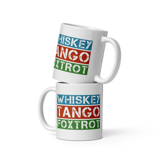 White glossy mug with "Whiskey Tango Foxtrot", part of the phonetic alphabet, in blue, red and green on the front and back of the mug.