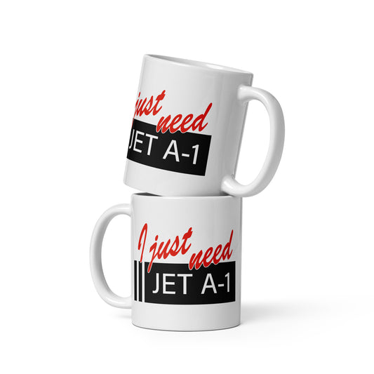 White ceramic 11oz mug with the phrase "I Just Need Jet A1" written in red script above a Jet A1 aviation fuel sign.