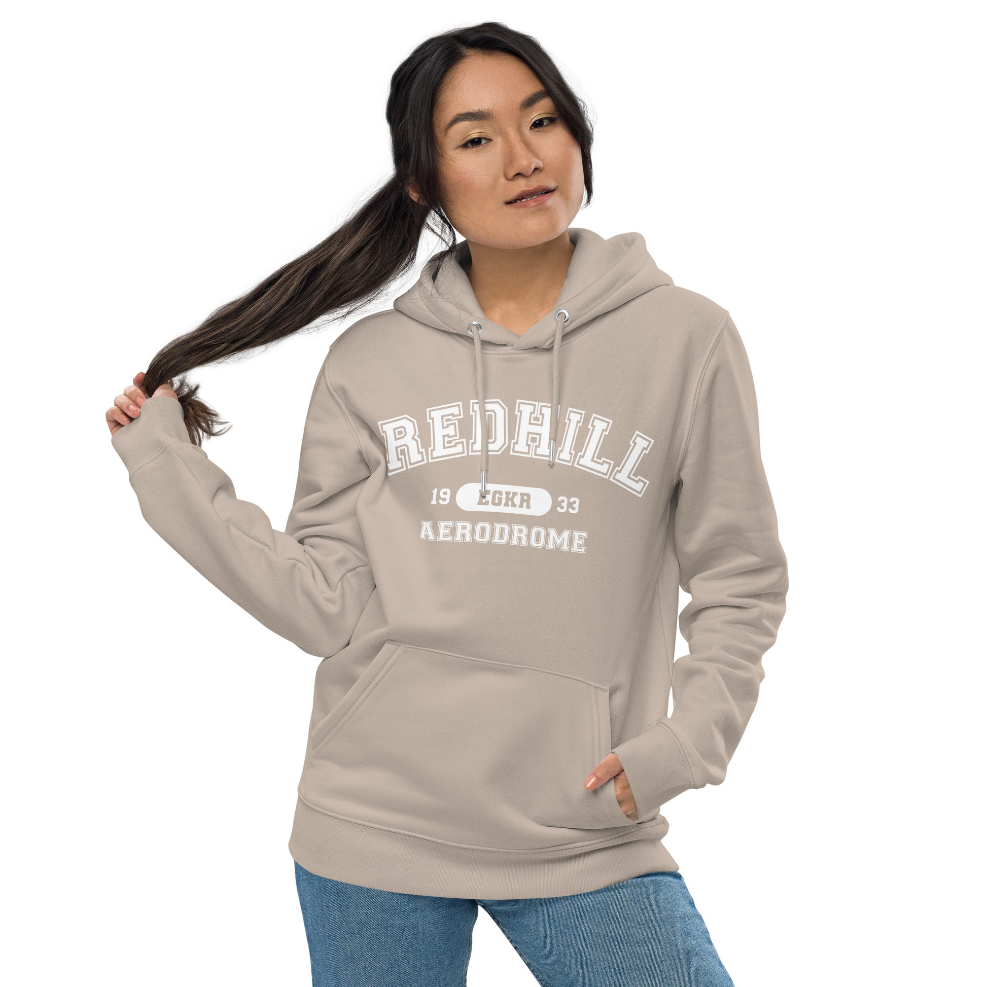 Coloured in a pale sand the Redhill Aerodrome heavyweight hoodie features a classic collegiate style print with the airport's name, ICAO code and date of construction on the front.