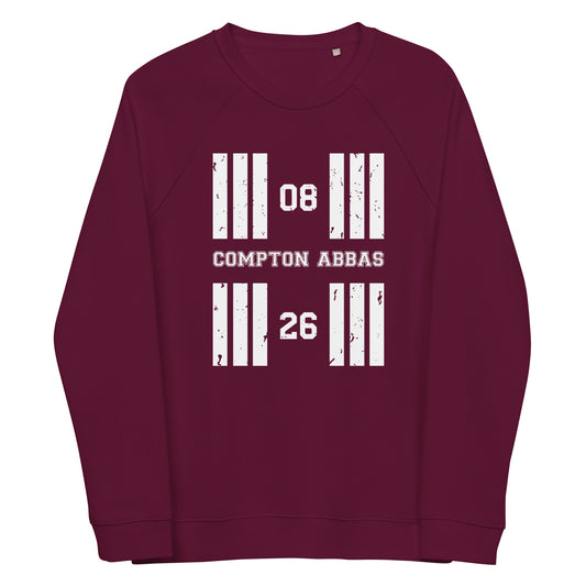 Burgundy coloured Compton Abbas Aerodrome runway designator raglan sweatshirt featuring a print with the airport's name and designator framed by stylised distressed threshold markings.