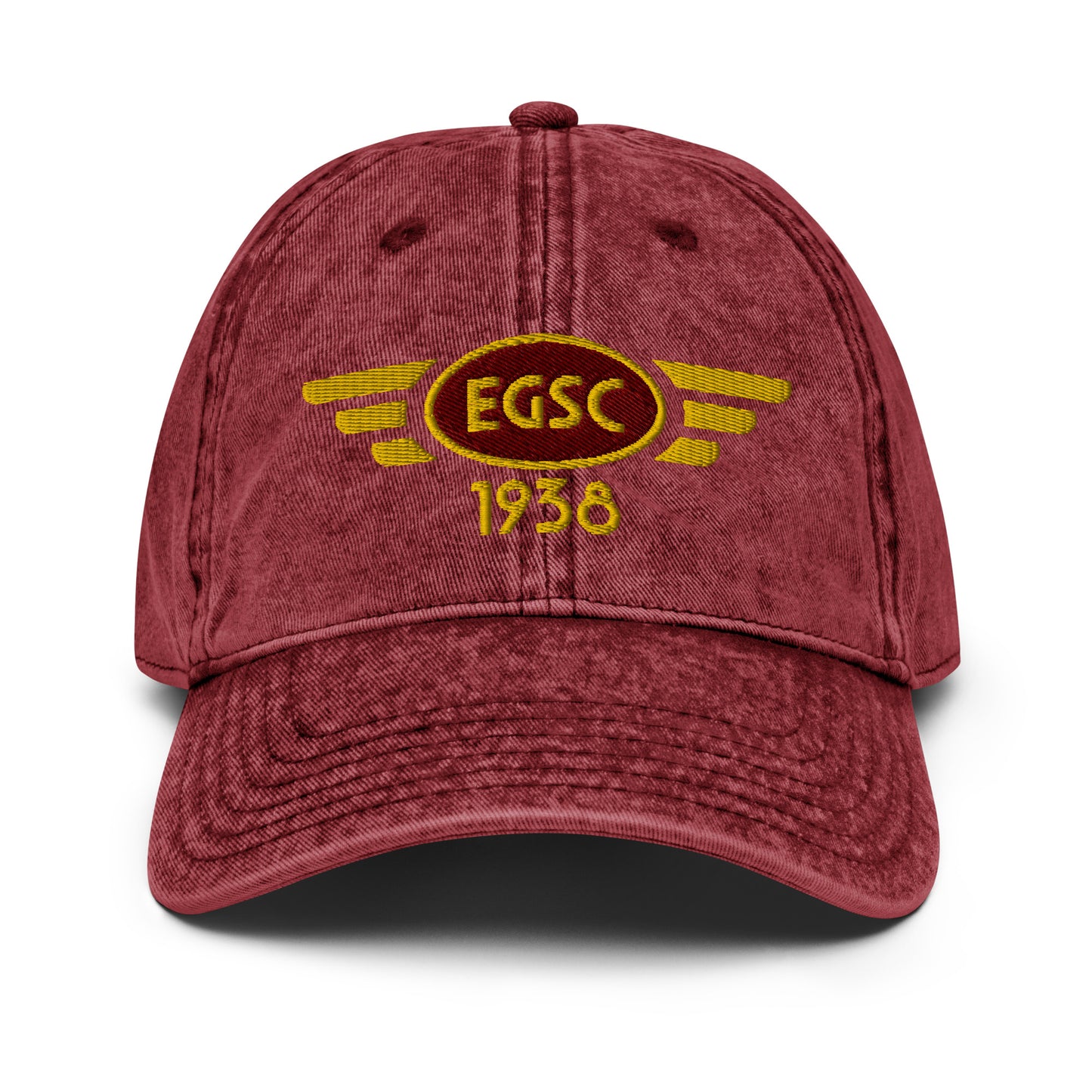 Burgundy coloured cotton twill baseball cap with embroidered vintage style aviation logo for Cambridge Airport.